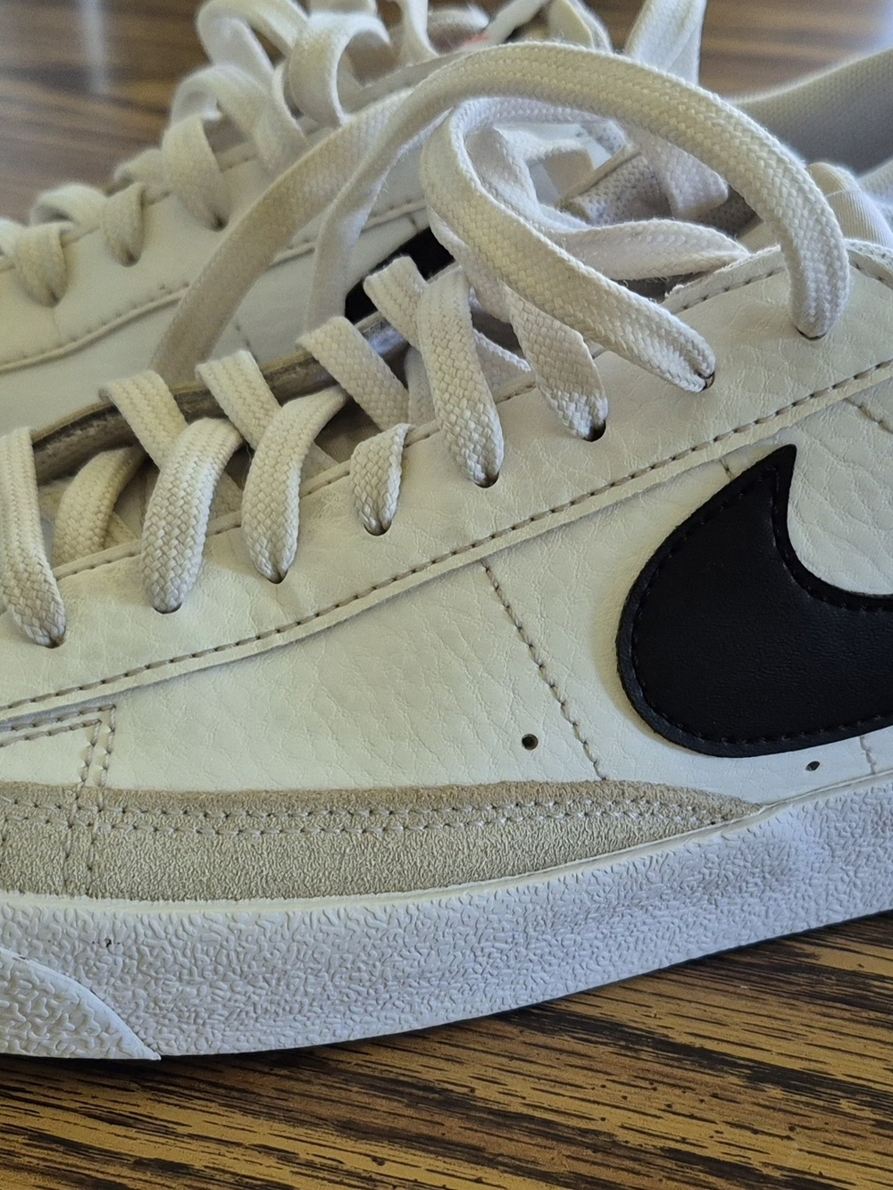 Nike White Low-Top Sneakers with Black Swoosh